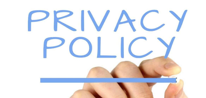 An image of a man's hand holding chalk and underlining the words "Privacy Policy."